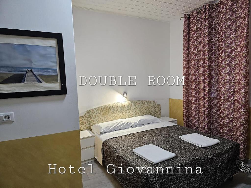 Postel nebo postele na pokoji v ubytování Hotel Giovannina