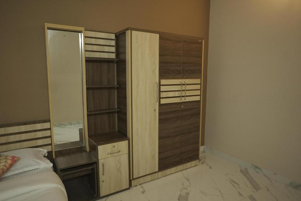 Postel nebo postele na pokoji v ubytování Luxe Hotel - Rooms & Villas Wayanad