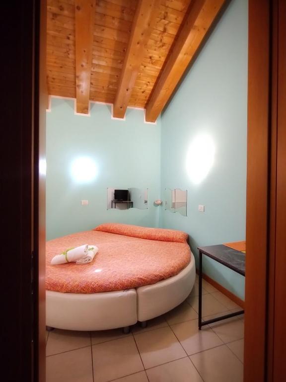 Postel nebo postele na pokoji v ubytování Quadrifoglio Relax