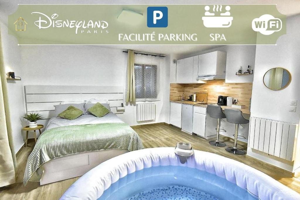 a hotel room with a bed and a bath tub at Magic Spa Studio Jacuzzi near Disneyland in Crecy la Chapelle