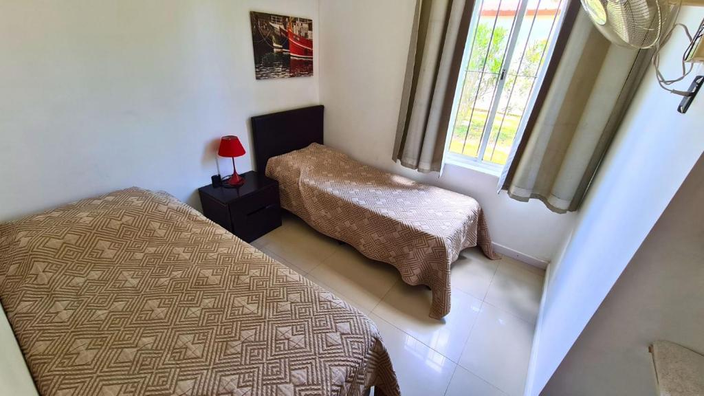 Postel nebo postele na pokoji v ubytování Complejo Cabañas Piriápolis