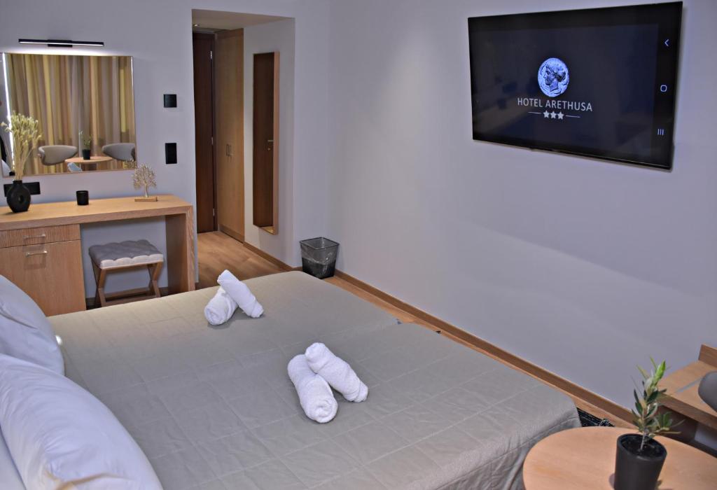 Posteľ alebo postele v izbe v ubytovaní Arethusa Hotel Athens