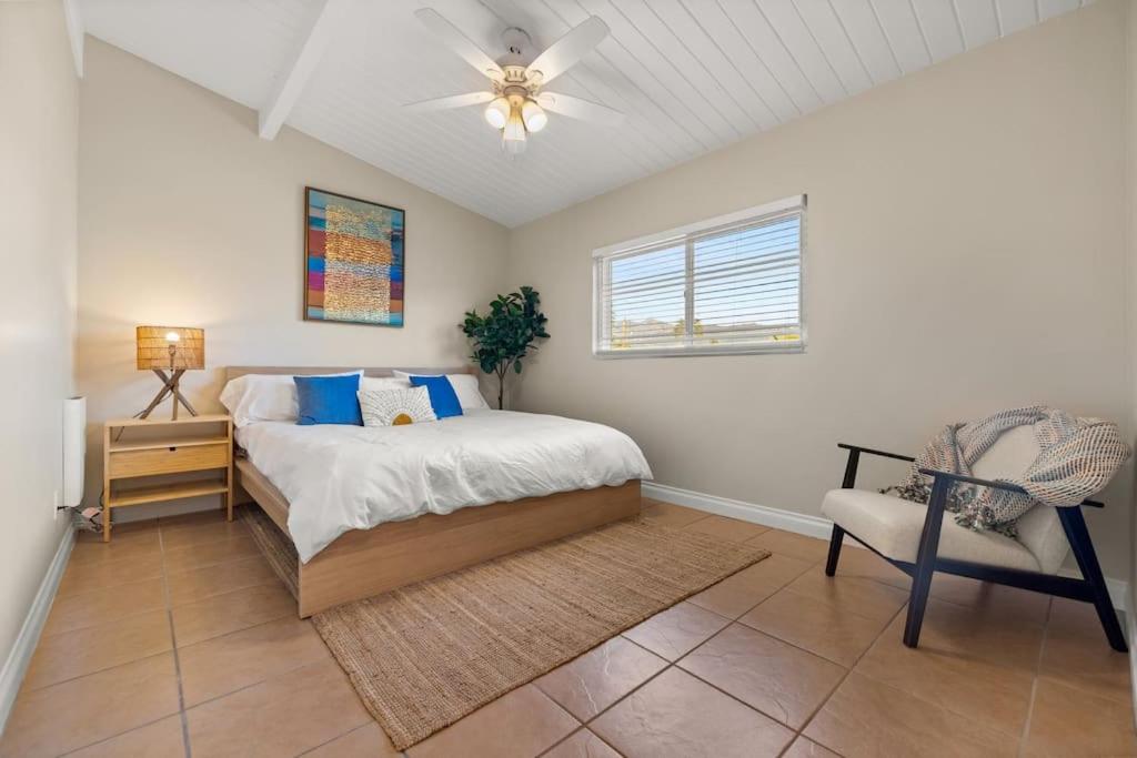 a bedroom with a bed and a chair in it at Downtown apt recently remodeled in Santa Barbara