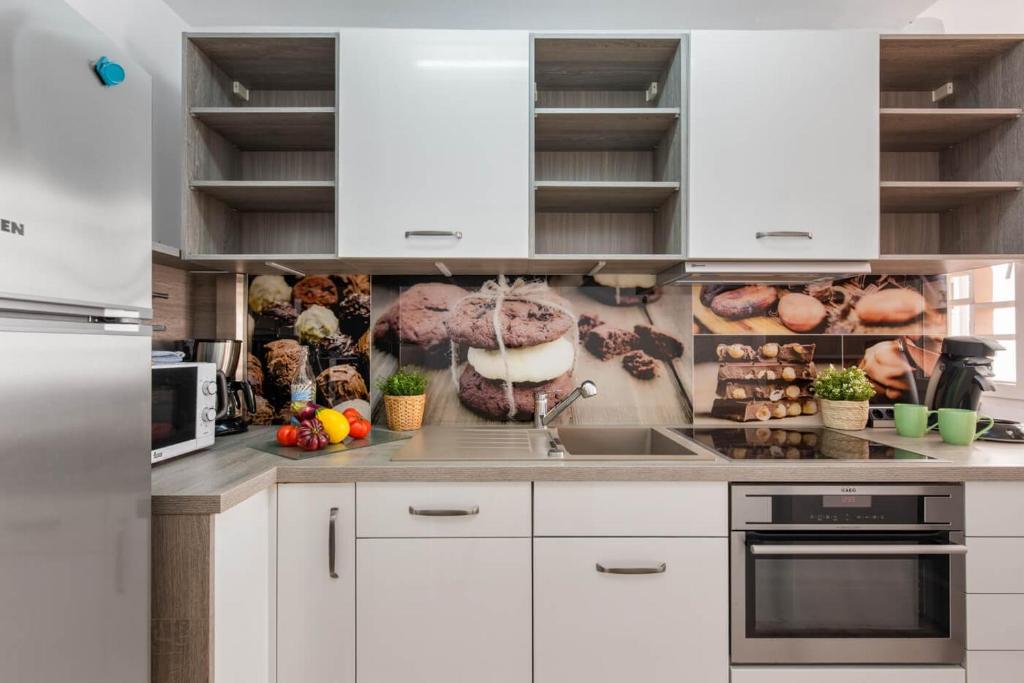 Kuchyň nebo kuchyňský kout v ubytování Apartment Penyon - PlusHolidays