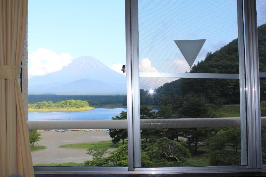 a view of a mountain from a window at Yamadaya Hotel in Fujikawaguchiko