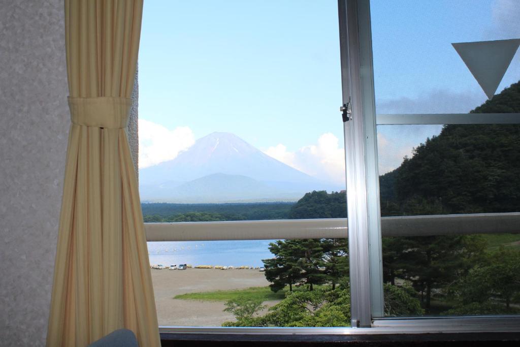 a view of a mountain from a window at Yamadaya Hotel in Fujikawaguchiko