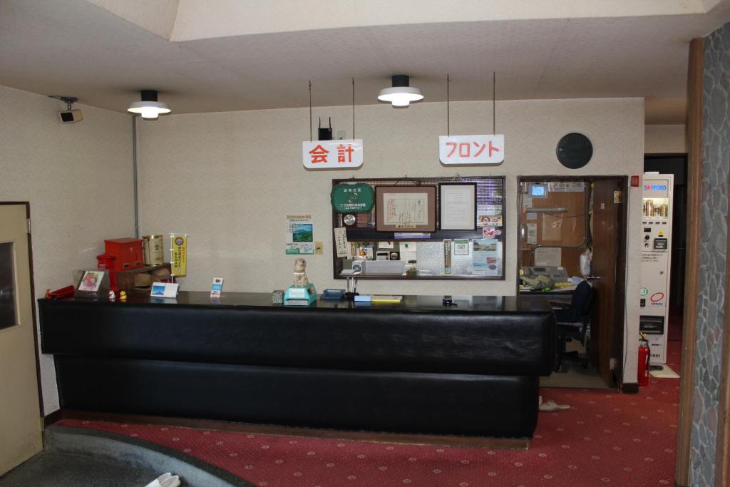 a waiting room with a cash counter in a store at Yamadaya Hotel in Fujikawaguchiko