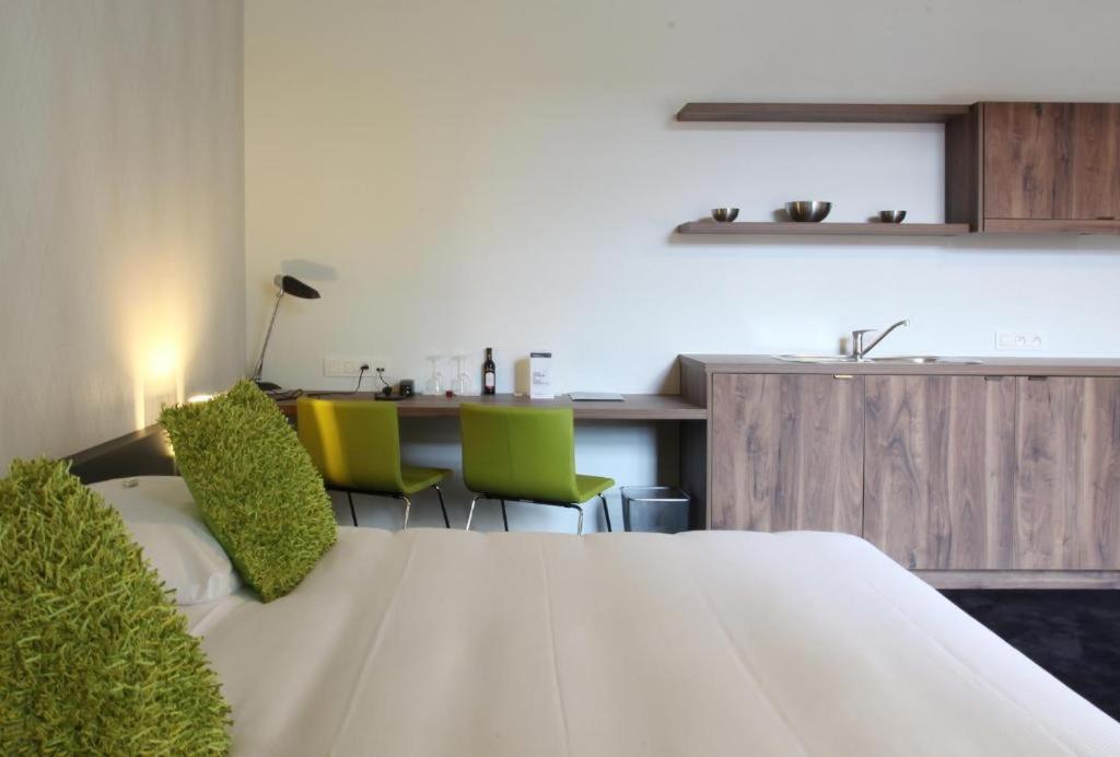 Postel nebo postele na pokoji v ubytování Hotel The Lodge Vilvoorde