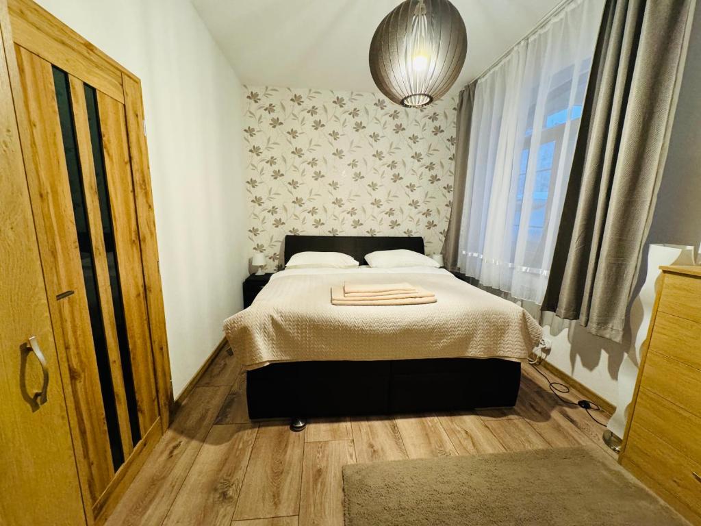 Postel nebo postele na pokoji v ubytování Apartmány KAMZÍK Donovaly