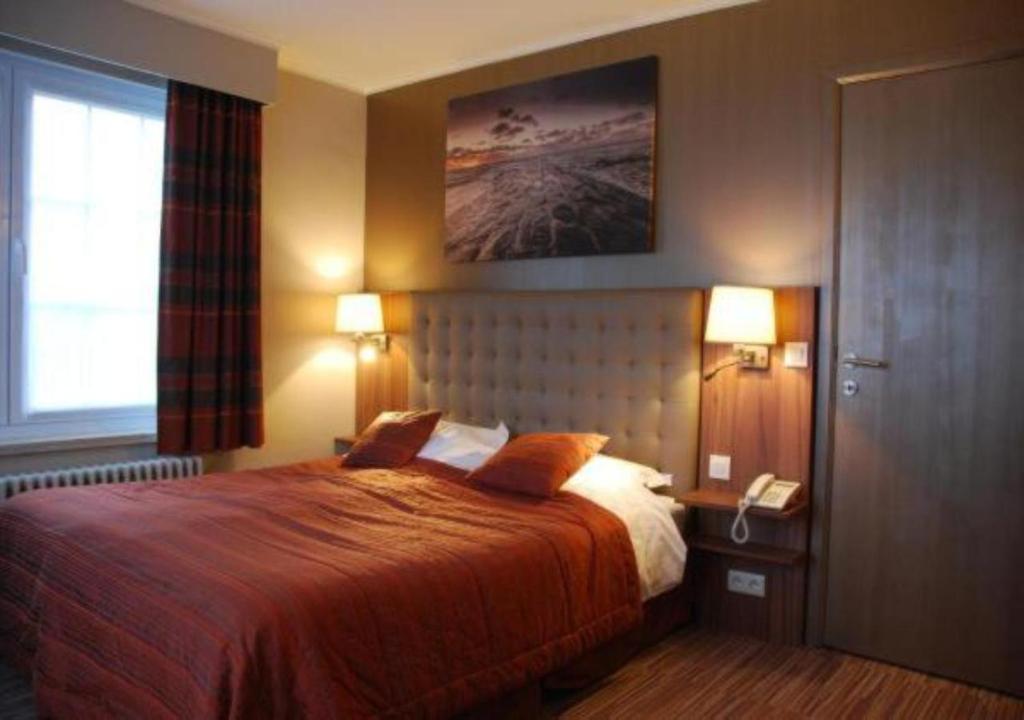 Postel nebo postele na pokoji v ubytování Hotel Rubens