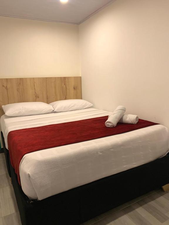 Postel nebo postele na pokoji v ubytování Hotel Urban Center Bogota