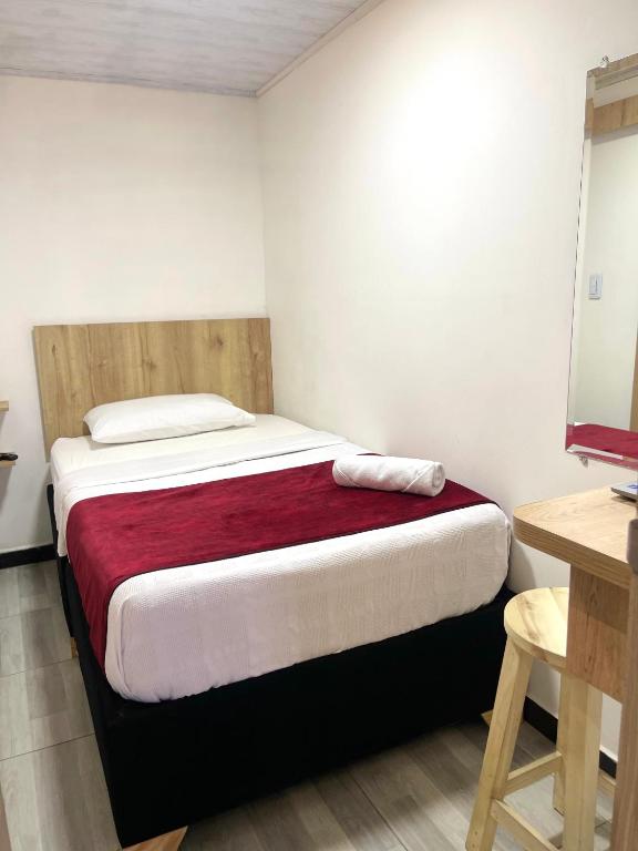 Postel nebo postele na pokoji v ubytování Hotel Urban Center Bogota
