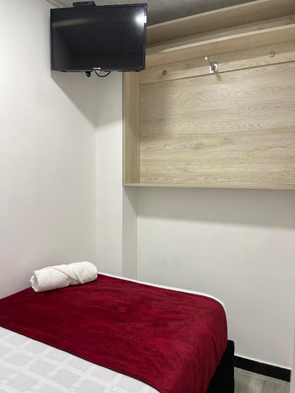 Postel nebo postele na pokoji v ubytování Hotel Urban Center Bogota