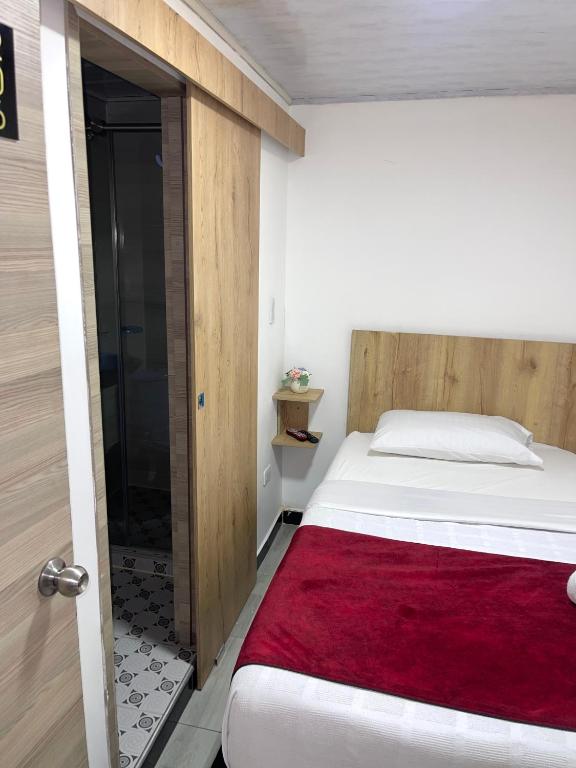 Postel nebo postele na pokoji v ubytování Hotel Urban Center Bogota