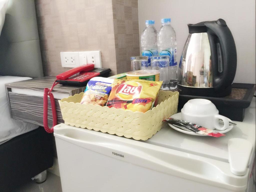 Příslušenství pro přípravu čaje a kávy v ubytování NRC Residence