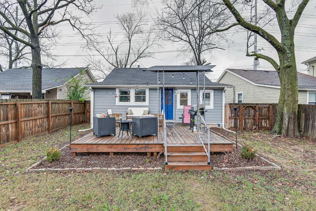 a house with a deck with a table and chairs at Charming Nashville Home with Fire Pit, Indoor Sauna! in Nashville
