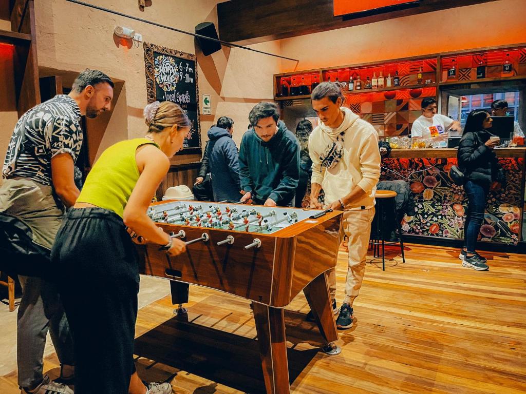 a group of people playing a game of foosball at Viajero Cusco Hostel in Cusco