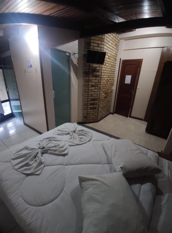 Cama ou camas em um quarto em Hotel D'Luz
