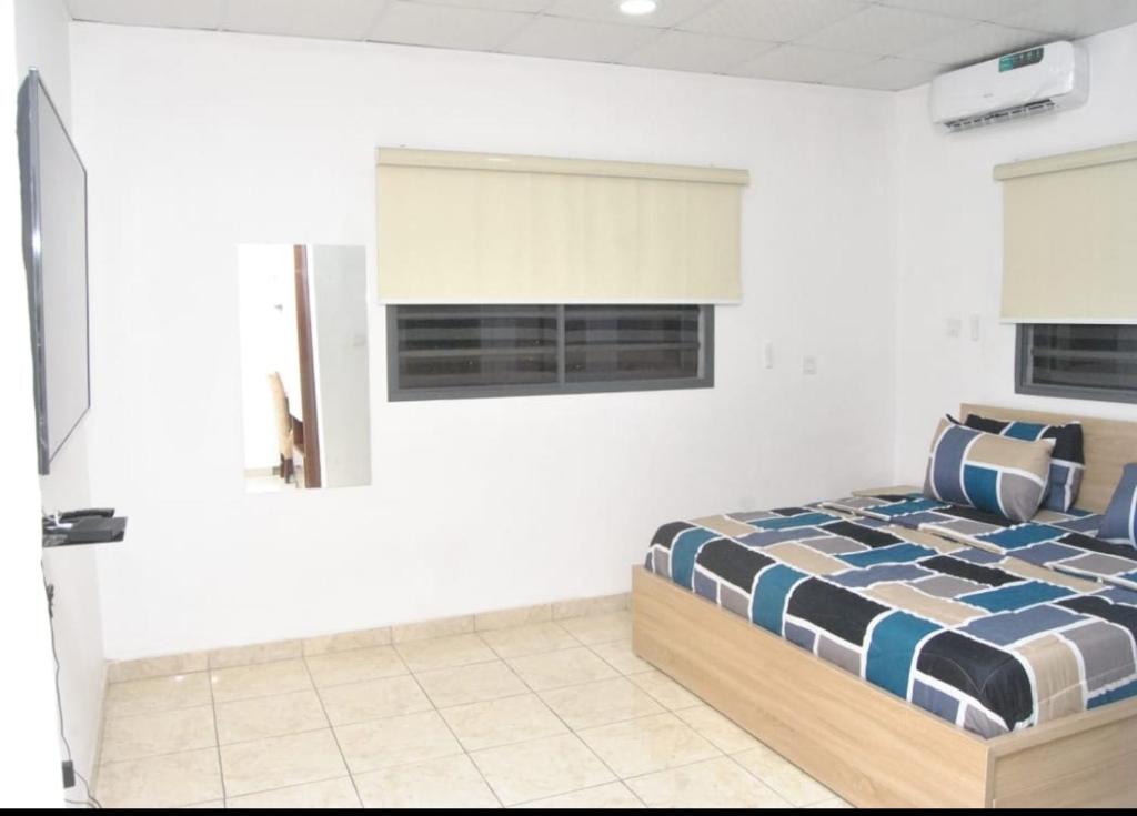 Postel nebo postele na pokoji v ubytování Ibadan Serviced Apartments