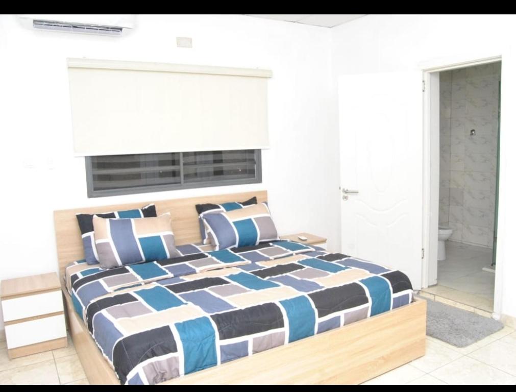 Postel nebo postele na pokoji v ubytování Ibadan Serviced Apartments