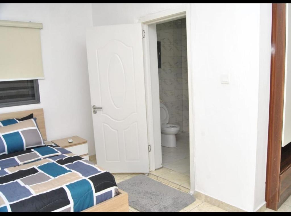 Postel nebo postele na pokoji v ubytování Ibadan Serviced Apartments