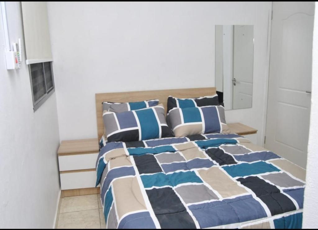 Postel nebo postele na pokoji v ubytování Ibadan Serviced Apartments