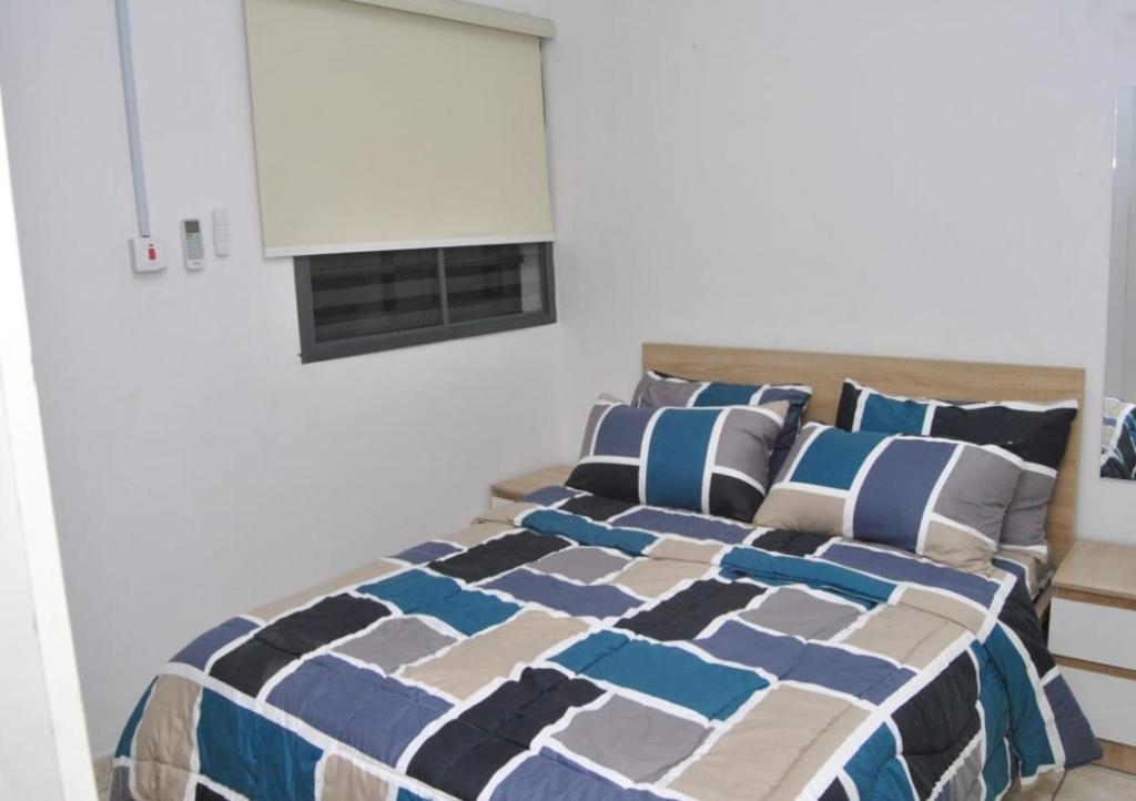 Postel nebo postele na pokoji v ubytování Ibadan Serviced Apartments
