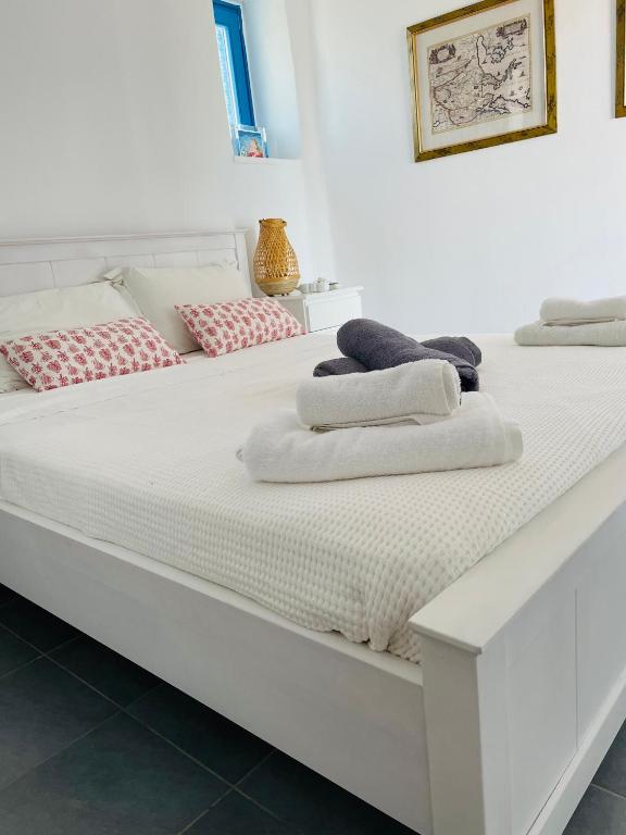Postel nebo postele na pokoji v ubytování Paros Home
