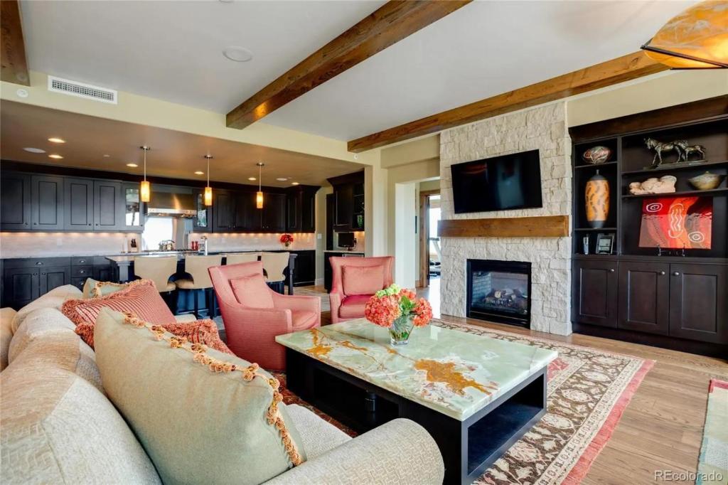 a living room with a couch and a fireplace at Edgemont 2301 Luxury Condo with Backdoor Ski-In Ski-Out Access! in Steamboat Springs