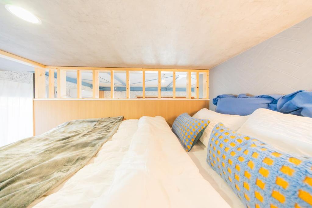 Postel nebo postele na pokoji v ubytování Skytree駅から徒歩2分 -Stay SUU Asakusa- & cafe bar