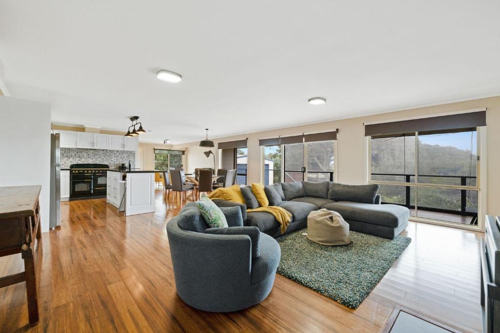 a living room with a couch and a table at Florida Bliss in Smiths Beach