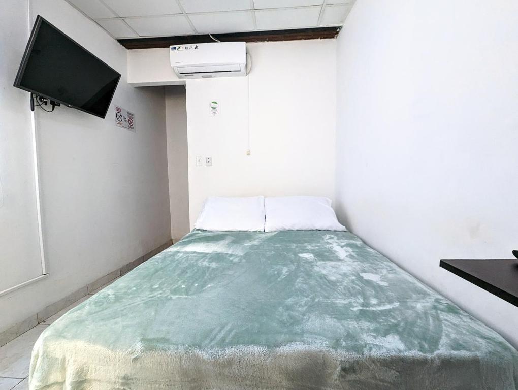 Postel nebo postele na pokoji v ubytování Hostal Yoha