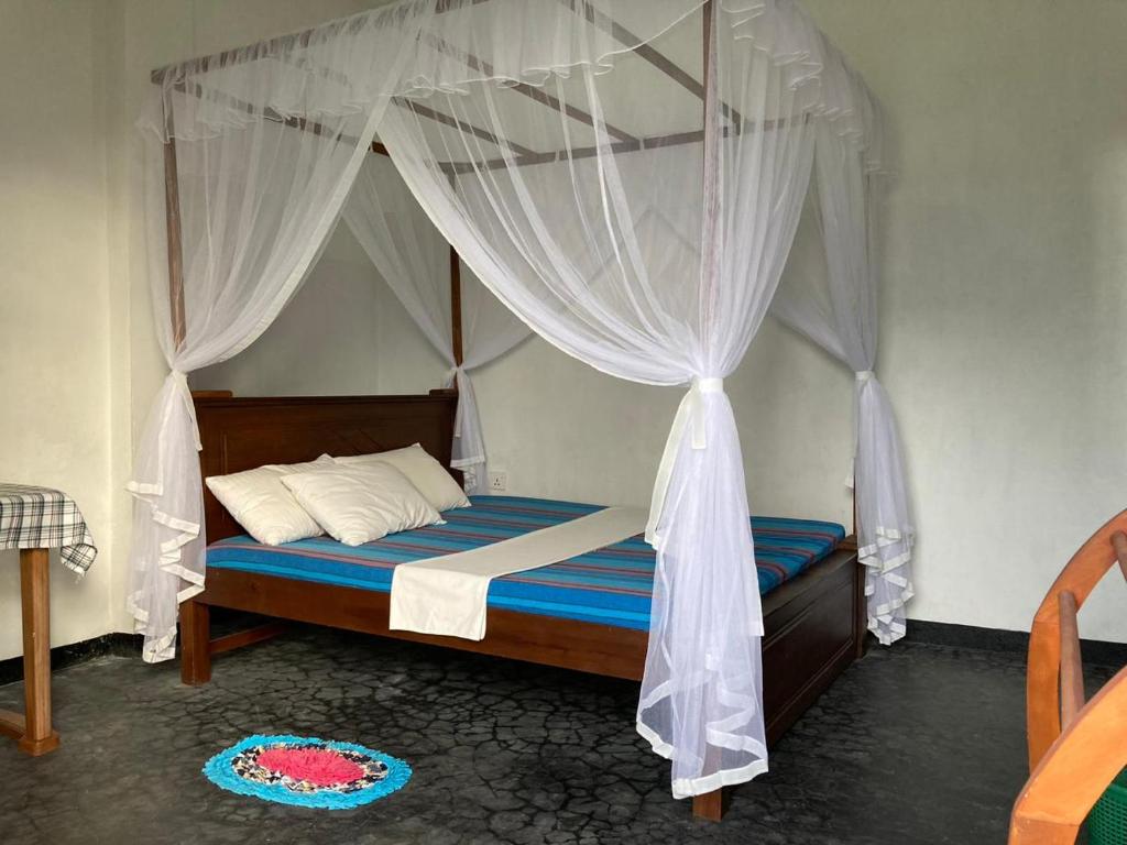 Postel nebo postele na pokoji v ubytování Sayura Beach Hotel