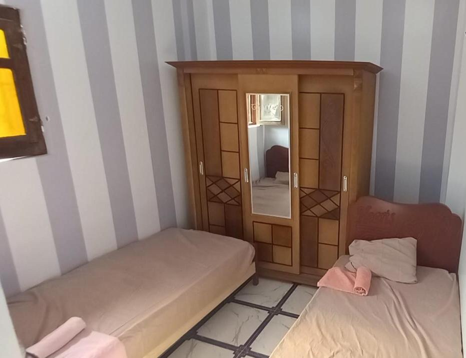 Postel nebo postele na pokoji v ubytování Zohra Guest House