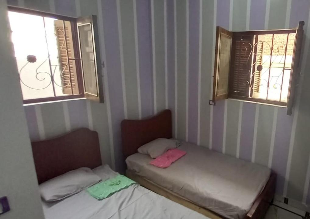 Postel nebo postele na pokoji v ubytování Zohra Guest House
