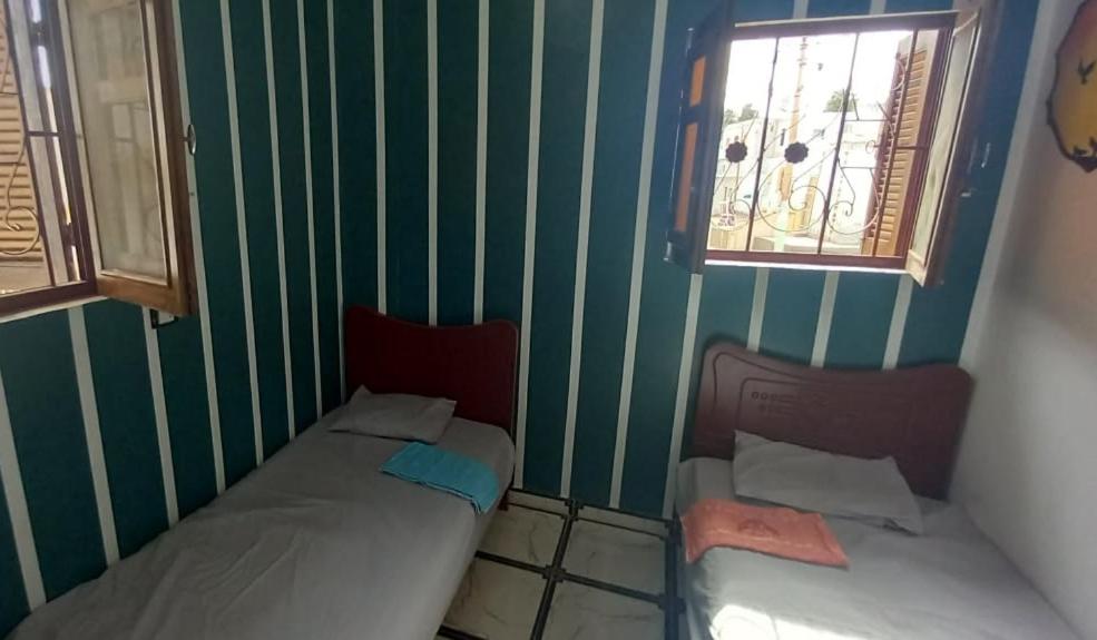 Postel nebo postele na pokoji v ubytování Zohra Guest House