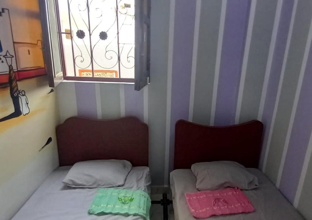 Postel nebo postele na pokoji v ubytování Zohra Guest House