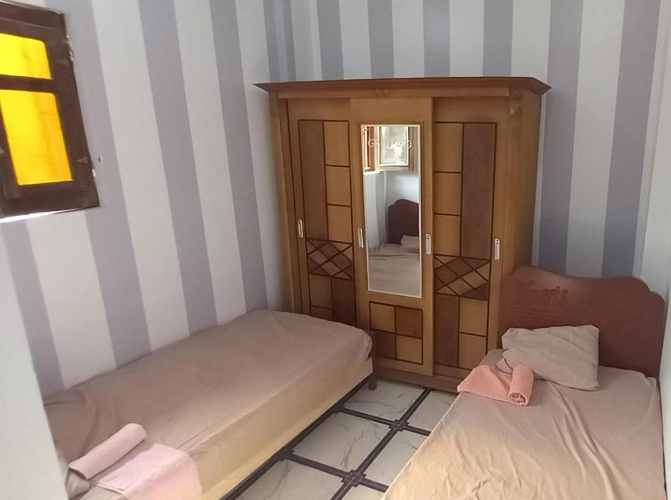 Postel nebo postele na pokoji v ubytování Zohra Guest House