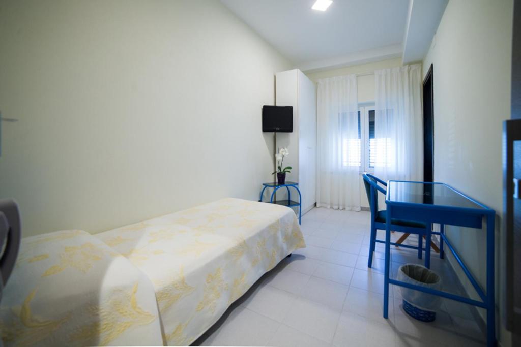Postel nebo postele na pokoji v ubytování Hotel Il Gabbiano