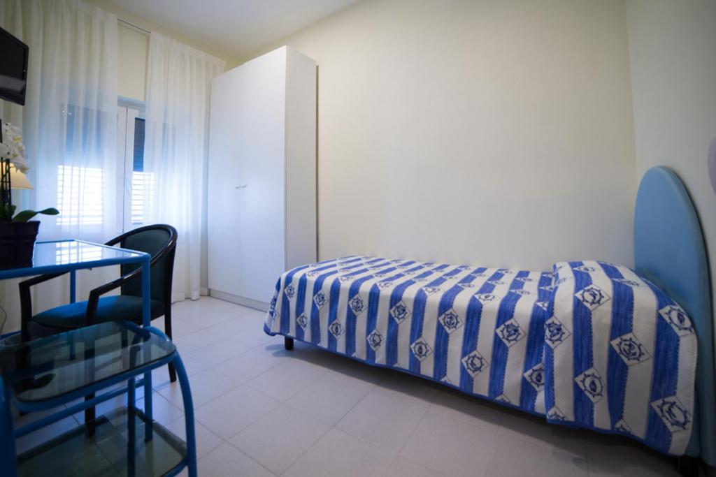 Postel nebo postele na pokoji v ubytování Hotel Il Gabbiano