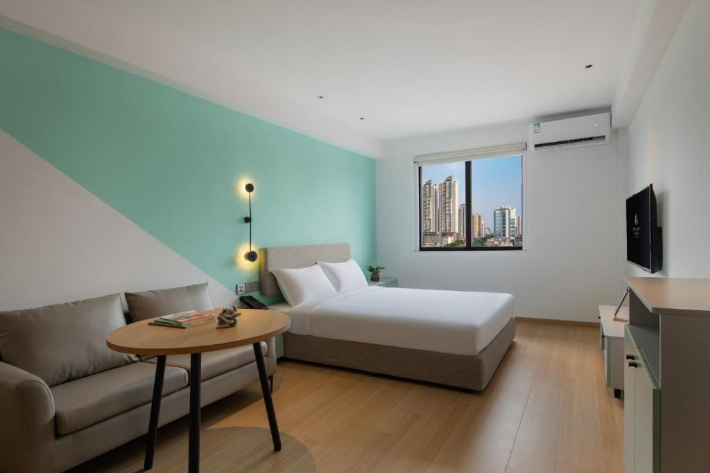 Postel nebo postele na pokoji v ubytování LNCommunity Guangzhou Haizhu Branch