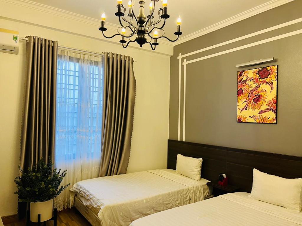 Letto o letti in una camera di Mộc Hương Hotel