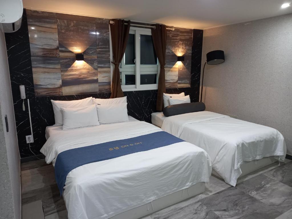 Postel nebo postele na pokoji v ubytování On & Off Hotel Bupyeong