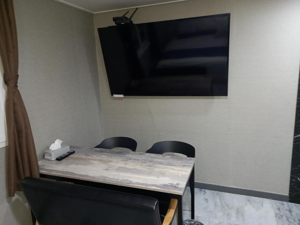 TV a/nebo společenská místnost v ubytování On & Off Hotel Bupyeong