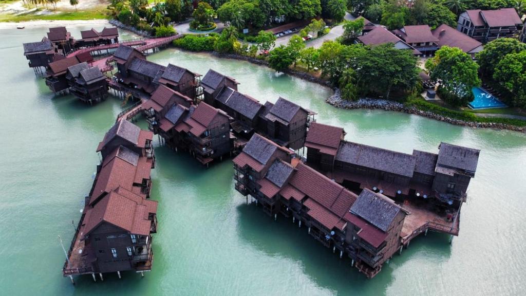 an aerial view of a group of houses in the water at Lagoon Residence @ Langkawi in Pantai Cenang