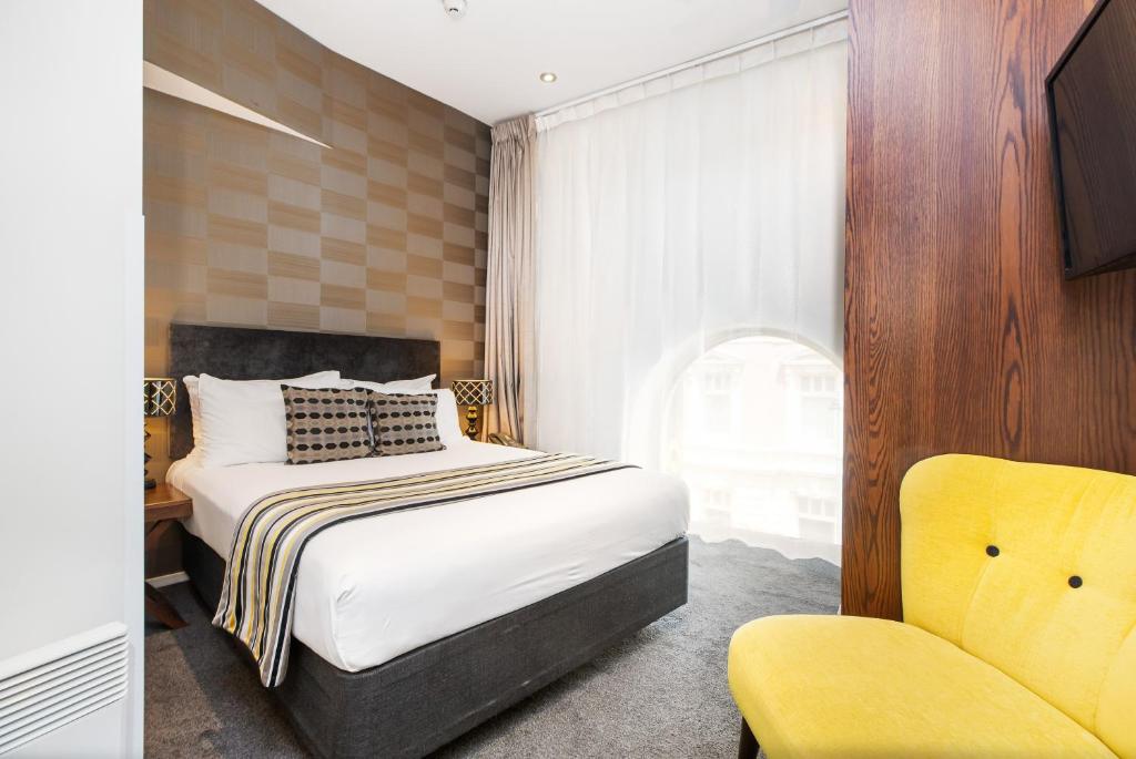 Postel nebo postele na pokoji v ubytování Hotel 115