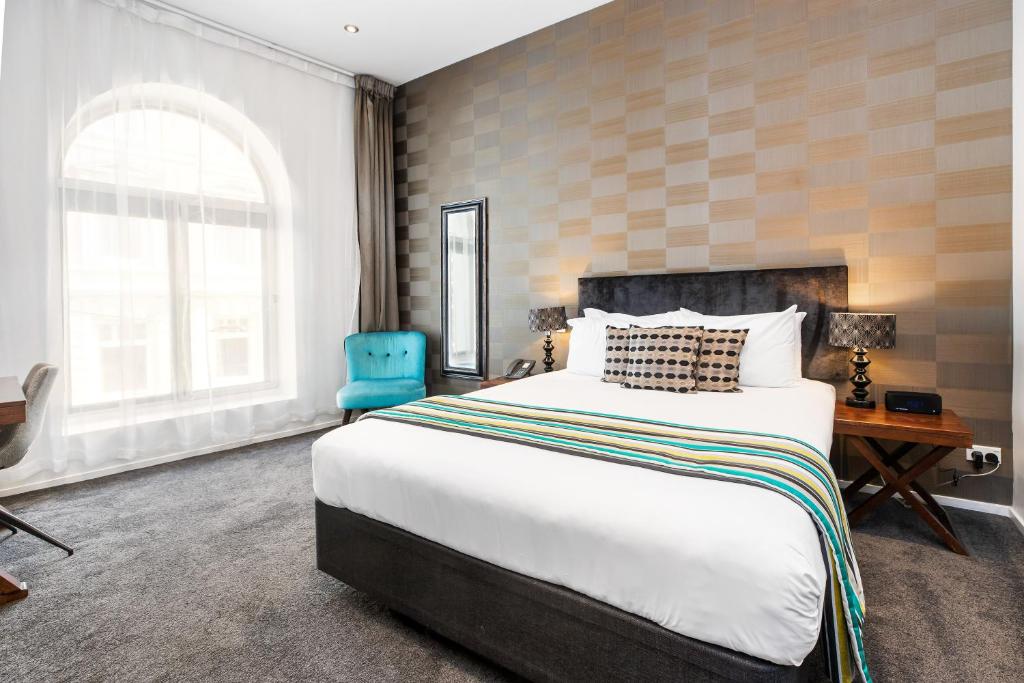 Postel nebo postele na pokoji v ubytování Hotel 115