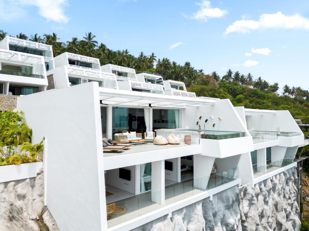 an architectural rendering of a white building on a cliff at Golden Lotus Villas in Amphoe Koksamui