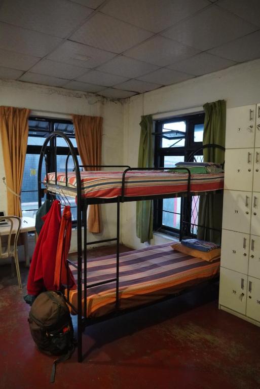 a bedroom with two bunk beds in a room at City View Hostel in Kandy
