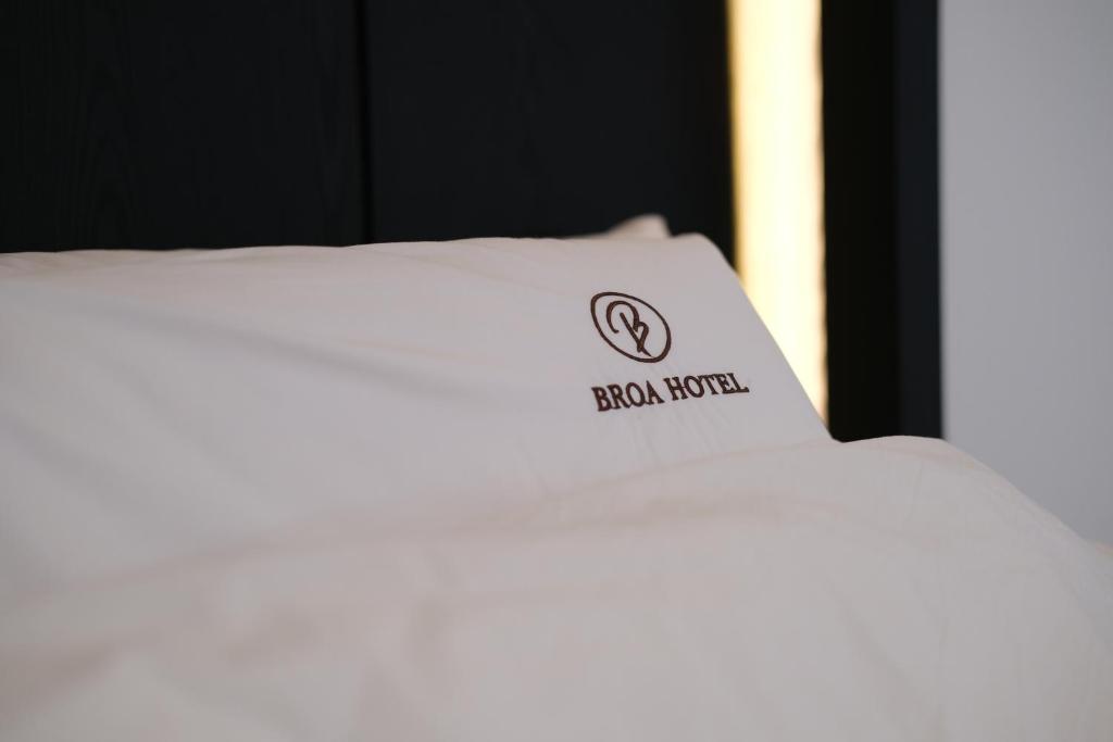 Postel nebo postele na pokoji v ubytování Busan Seomyeon Broa Hotel